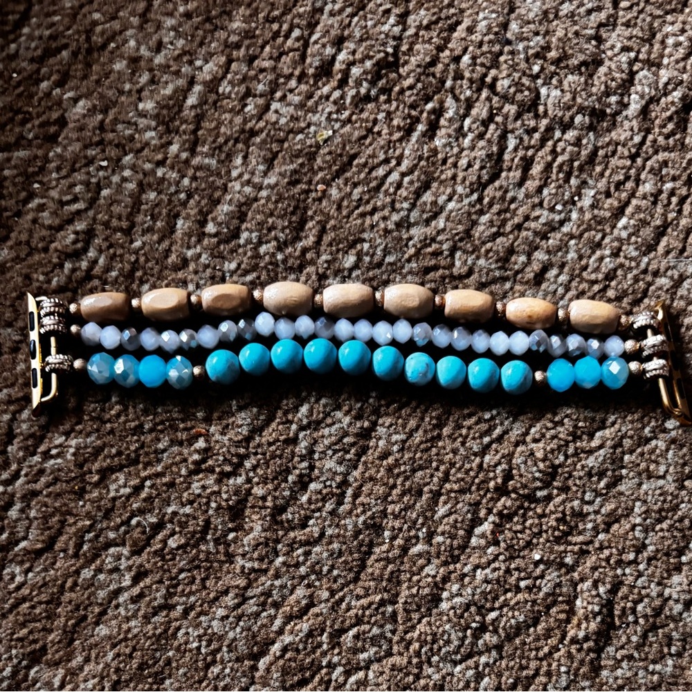 This is an Apple Watch band with Blue and Brown Accents